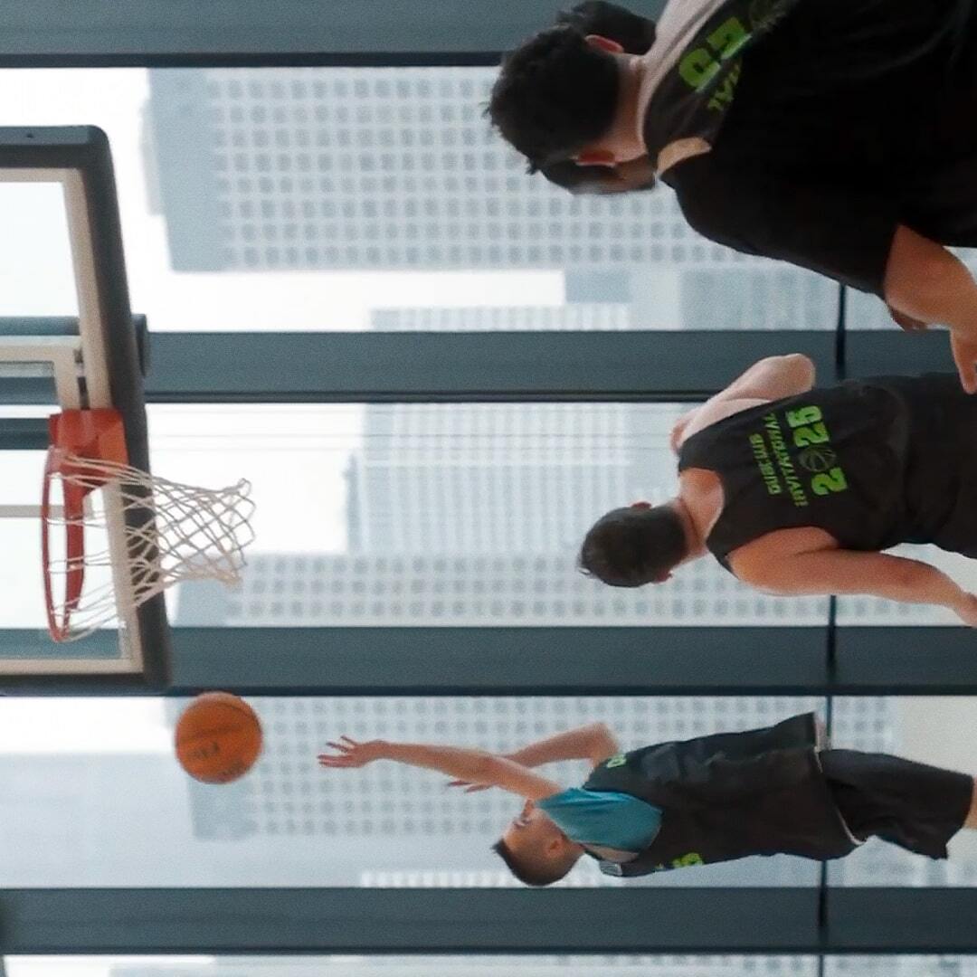 Basketball game partner making a layup